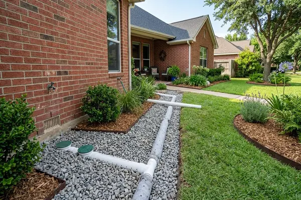 Perimeter foundation soaker hose watering system around North Texas residential slab